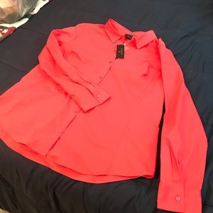 Woman’s new orange blouse